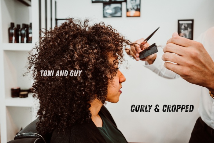 Stylish cropped curly haircut service for women at Toni & Guy in Coimbatore