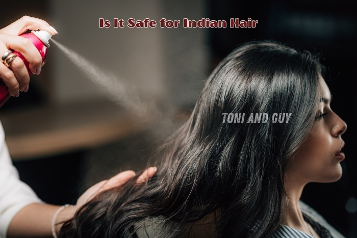 A Hair Stylist applying professional hair spray treatment at TONI & GUY Coimbatore for Smooth, Shiny hair