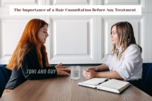 A professional stylist at TONI & GUY Coimbatore offering a detailed hair consultation before treatment
