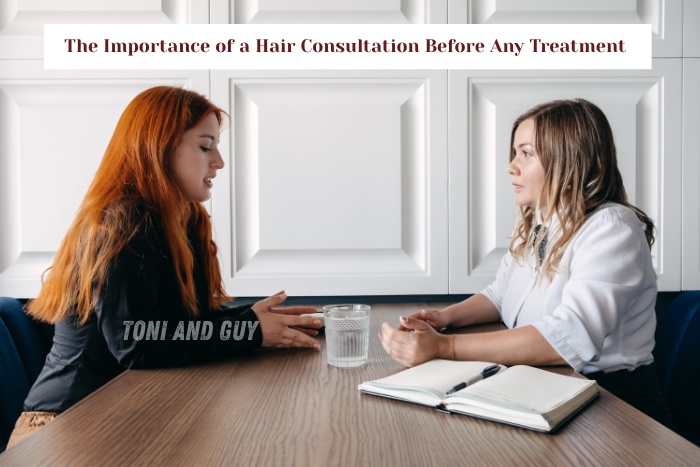 A professional stylist at TONI & GUY Coimbatore offering a detailed hair consultation before treatment
