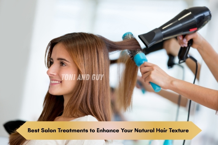 A professional stylist blow-drying and enhancing a client’s natural Hair Texture at TONI & GUY Coimbatore